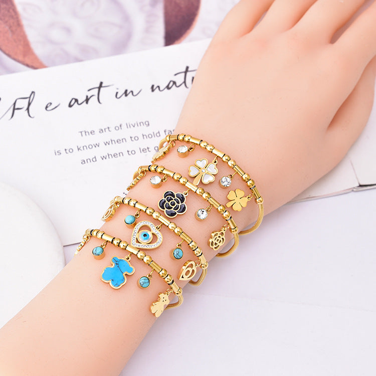 Pulsera de Hueso de Serpiente Geométrica Colorida con Oso y Dijes