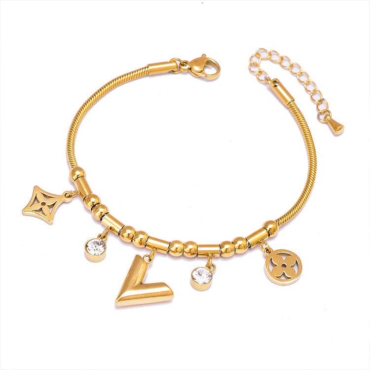 Pulsera de Hueso de Serpiente Geométrica Colorida con Oso y Dijes